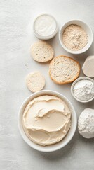 A slice of bread topped with a creamy layer of cream cheese sits on a smooth grey backdrop, providing a minimalist aesthetic perfect for culinary inspiration or breakfast ideas