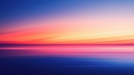 Fototapeta premium A stunning sunset over a tranquil sea, featuring vibrant hues of pink, purple, and blue, creating a serene atmosphere.