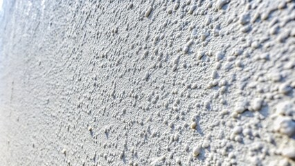 Textured White Concrete Wall with Subtle Imperfections Perfect for Modern Design and Architecture Projects