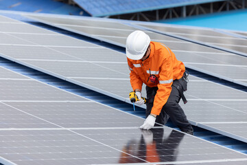 Engineer repair solar panel on the factory rooftop