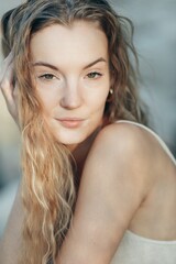 Fototapeta premium Young Caucasian Blonde curly-haired Woman Portrait. Summer Outdoors. Pure Skin, Natural Beauty