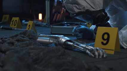 Forensic expert working at fantastic crime scene with evidence like robot hands. Lots of evidence...