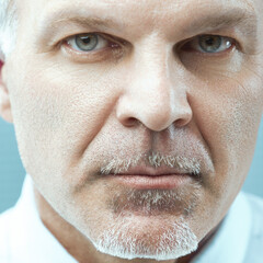 Serious businessman making direct eye contact