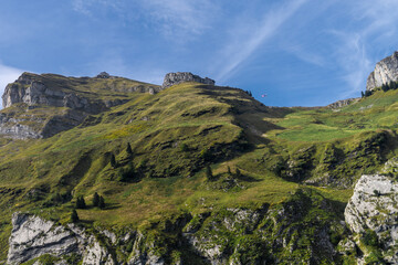 mountain landscape, Schafler mountain hut and    Airplane Jet flying next to peak, Alpstein, Swiss alps