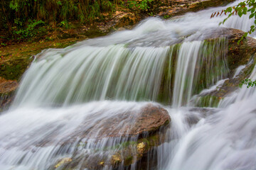 Water flows fast in a mountain stream After heavy autumn rains