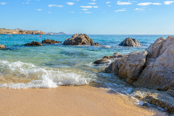 Different stages of the fantastic ocean waves. Rocky and sandy beach. Santa Maria Beach, Cabo San Lucas, Mexico.