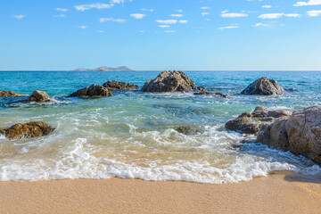 Different stages of the fantastic ocean waves. Rocky and sandy beach. Santa Maria Beach, Cabo San Lucas, Mexico.