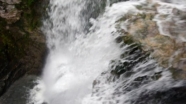 The mountain stream swollen by the abundant rains of the coming autumn