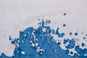 Metallic background with peeling blue paint simulating a wave