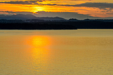 ocean sunset over mountains at summer day in Vancouver, Canada