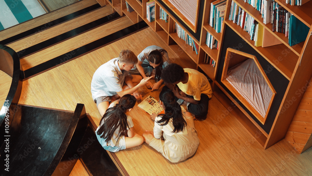 Poster top view of diverse children sitting in circle while looking at camera and waving hands at library s
