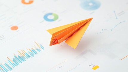 Paper airplane model on financial charts and graphs, white background.