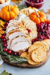 Thanksgiving charcuterie board featuring turkey slices, rosemary crackers, and cranberry studded cheese