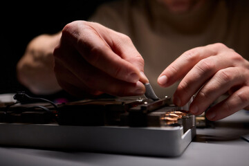 Hand Repairing a Graphics Card through the Application of Thermal Paste for Better Performance