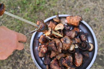 the finished kebab is removed from the skewer on a tray