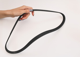 car generator belt in a woman's hand