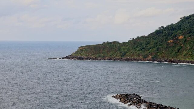 View from Mount Urgul to the breakwater and cape covered with vegetation