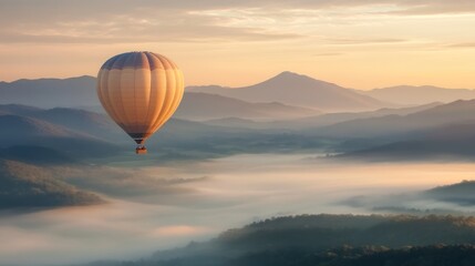 Fototapeta premium Hot Air Balloon Flying Above Misty Mountains