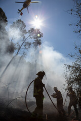 A forestry brigade participate in the extinction of a forest fire in Galicia