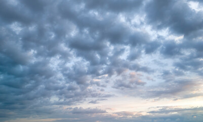 A stunning view of a cloudy sky during sunset, showcasing a blend of vibrant colors. Ideal for nature and abstract photography themes.