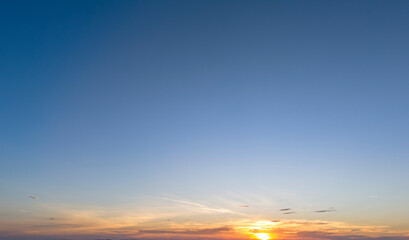 A breathtaking sunset illuminating the sky, showcasing vibrant colors blending together. A serene moment that captures nature's beauty.