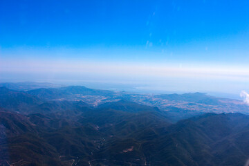 Breathtaking view of the sea and land from the plane in Sardinia