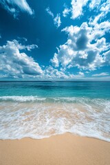 Obraz premium Tranquil beach with gentle waves and vibrant clouds under a bright blue sky