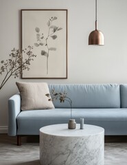 minimalist and light blue sofa in the background, with an abstract botanical poster on the wall