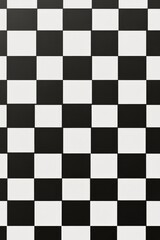 Black and white checkerboard floor design featuring alternating marble tiles in a modern space