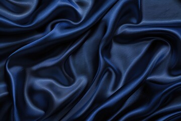 Obraz premium Navy blue silk satin luxury background for design.