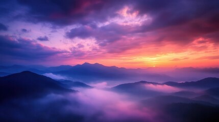 Obraz premium Sunrise Over Foggy Mountains