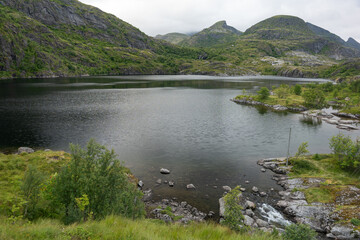 Mountains surrounded lake cloudy weather, Lofoten Norway