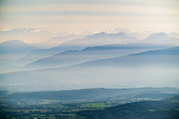 Aerial view of the Alps cloaked in gentle mist