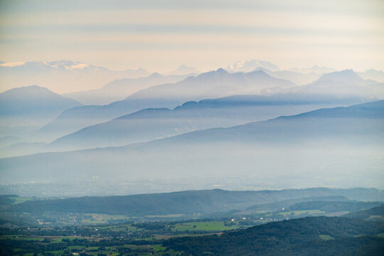 Aerial view of the Alps cloaked in gentle mist