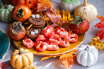 Colorful Halloween treats with cookies and pumpkin decorations