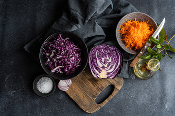 Fresh vegetable salad ingredients on dark background