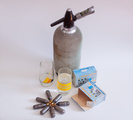 Vintage retro CO2 Siphon Dispensder bottle and CO2 charger canister. Soda Stream ancestor.