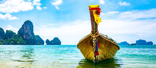 Amazing view of beautiful Ao Nang Beach with longtale boat. Location: Krabi Province, Thailand, Andaman Sea. Artistic picture. Beauty world.