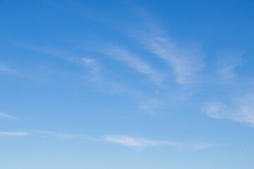 blue sky with thin clouds