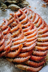 Fresh shrimp display on ice at seafood market, showcasing premium quality shrimp for sale or cooking