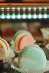 French desert stacked by color and flavors, popular sweet meringue-based cookie with a light airy...