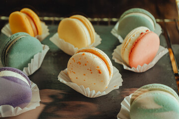 French desert stacked by color and flavors, popular sweet meringue-based cookie with a light airy...