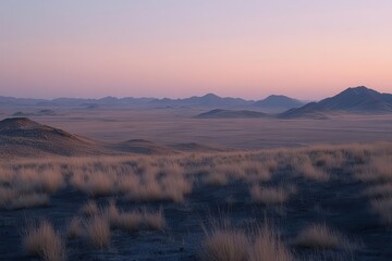 Serene desert landscape at dusk, showcasing rolling hills and soft grass under a pastel sky.