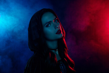 Photo of evil devil wizard lady look wear halloween theme coak isolated on neon mist multicolor...