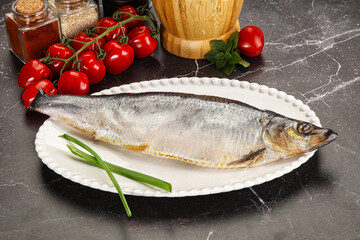 Whole raw salted herring fish