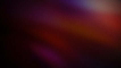 A dark grainy gradient blending deep reds, purples, and subtle oranges. This abstract backdrop creates a moody and rich atmosphere for digital design and backgrounds