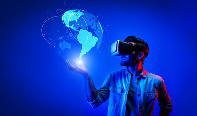 Smart man using VR goggle to connect global network connection. Happy man with casual cloth access futuristic global cloud computing server or software by wearing visual reality headset. Deviation.