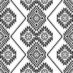 Fototapeta premium Ancient echoes Aztec geometric seamless patterns southwest Navajo Native American tribal ethnic black and white for textile printing