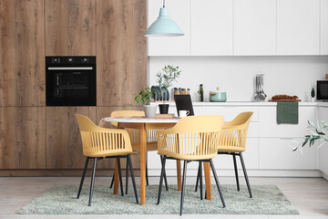 Table with chairs and counters in interior of dining room