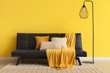 Interior of living room with black lamp and couch